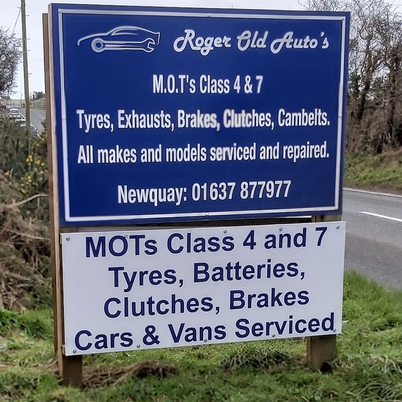 Roger Old Auto's roadside board: MOTs Class 4 and 7, tyres, exhausts, brakes, clutches, cambelts, all makes and models serviced and repaired